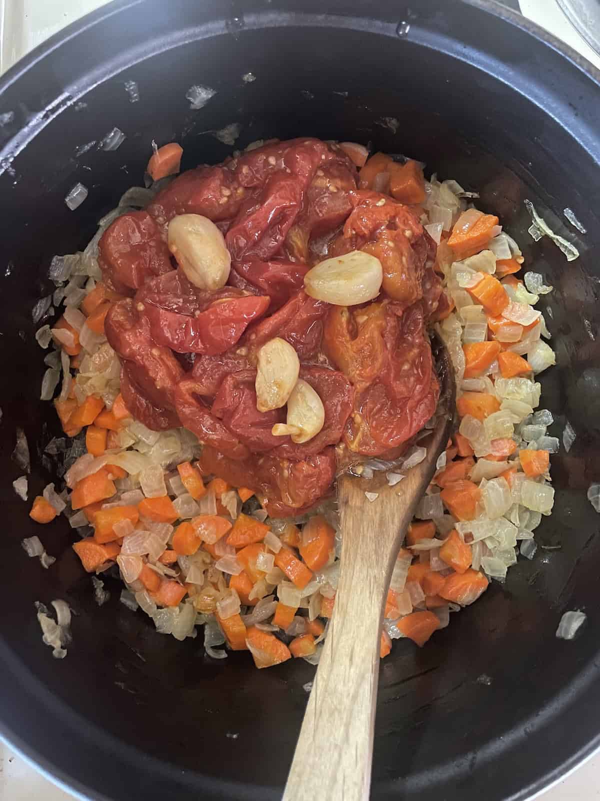 add roasted tomatoes and garlic