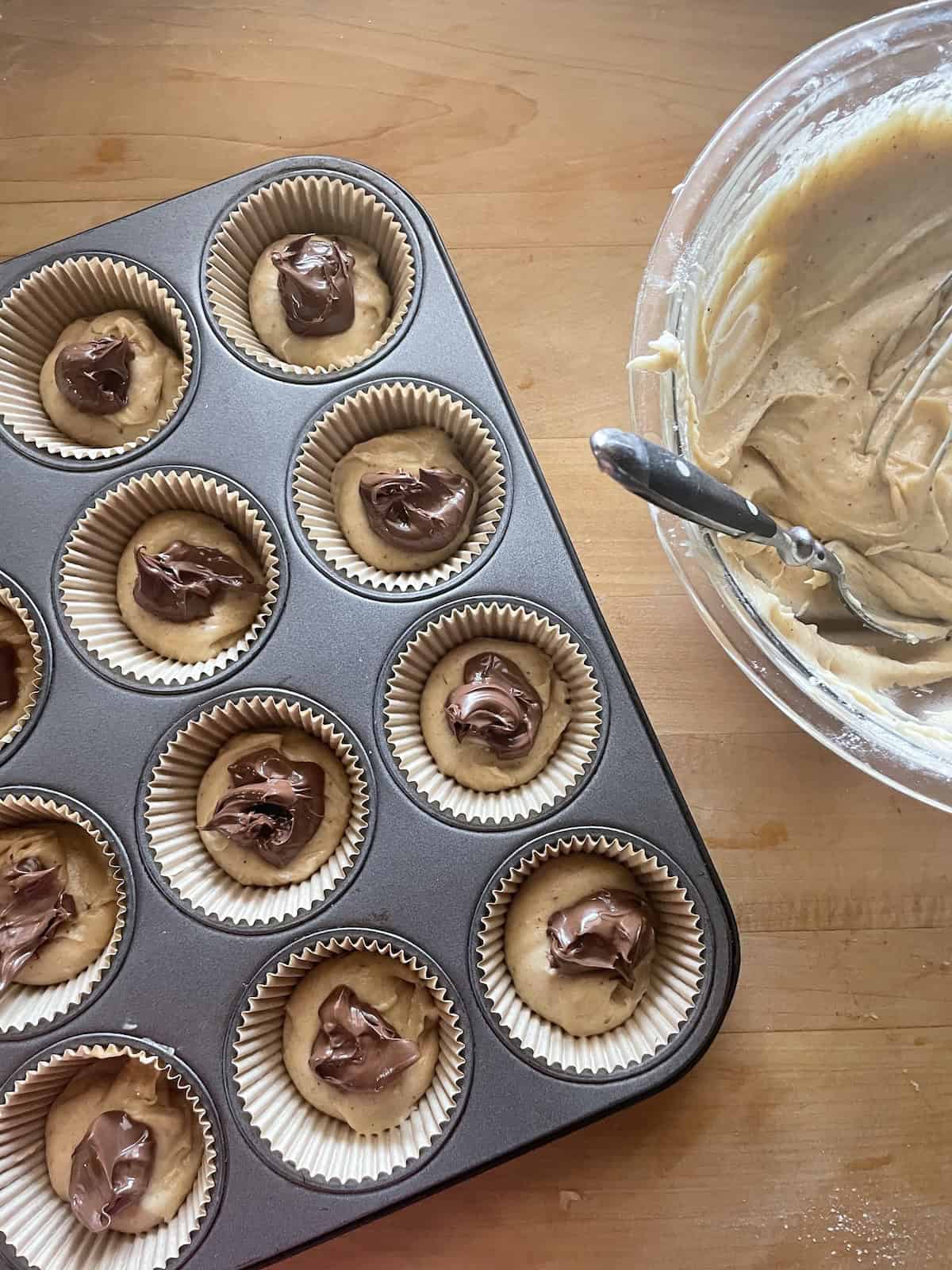 adding hazelnut spread to muffins