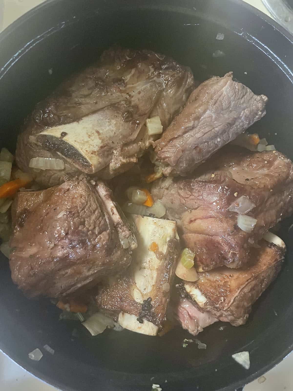 adding short ribs to pot