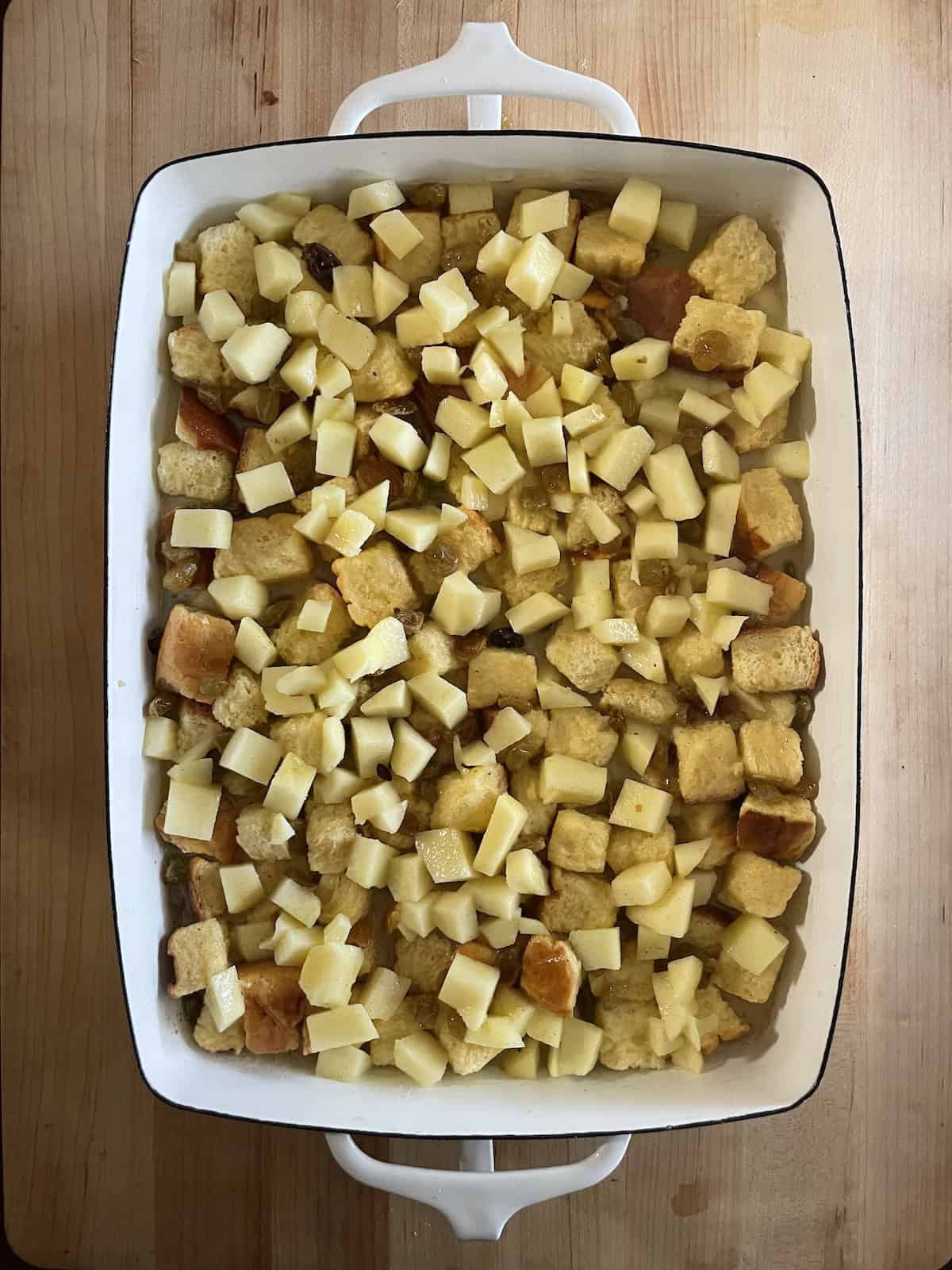 Top with apples and raisins and custard.