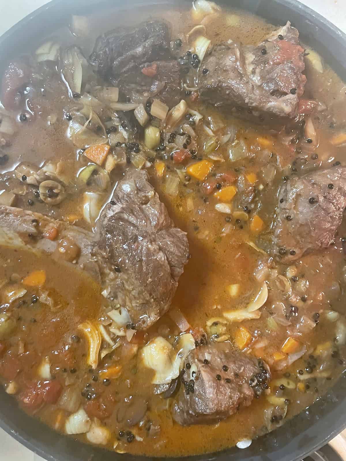 adding lentils, artichokes and olives to pot