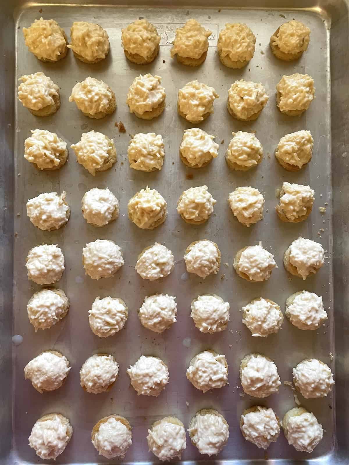 topped bread rounds on a cookie sheet