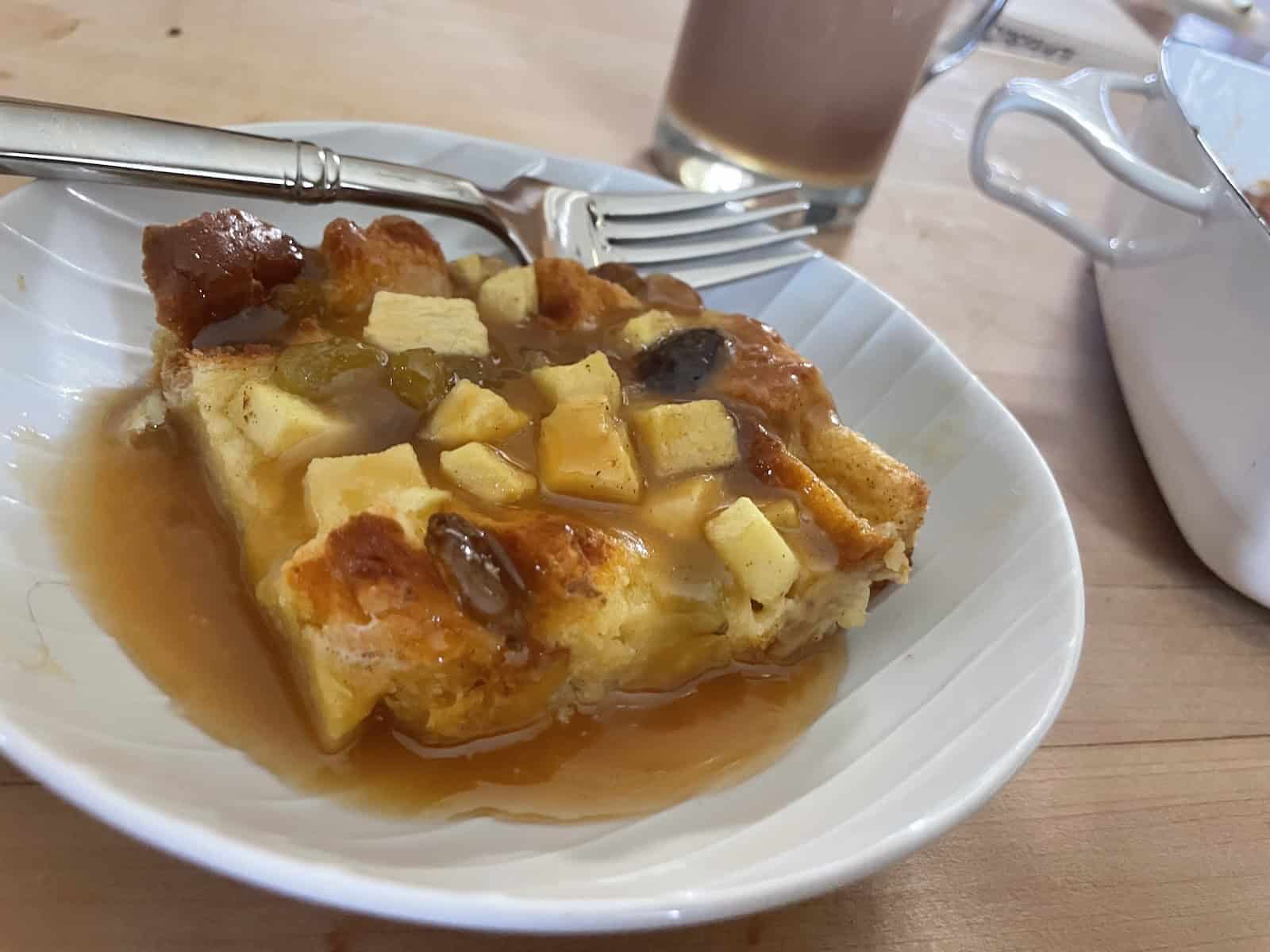 Eggnog Bread Pudding with Irish Cream Caramel Sauce on a plate