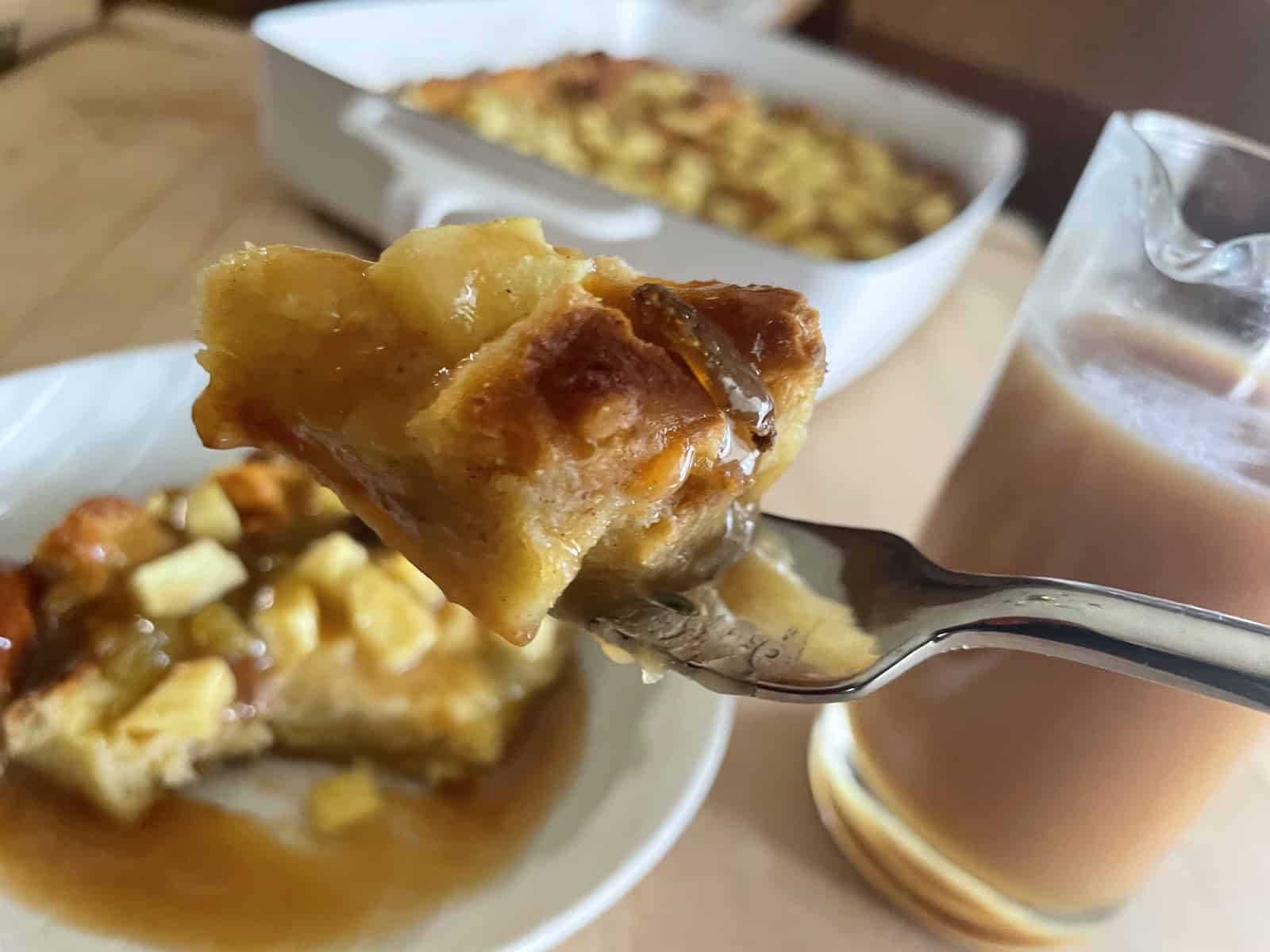 Eggnog Bread Pudding with Irish Cream Caramel Sauce on a fork