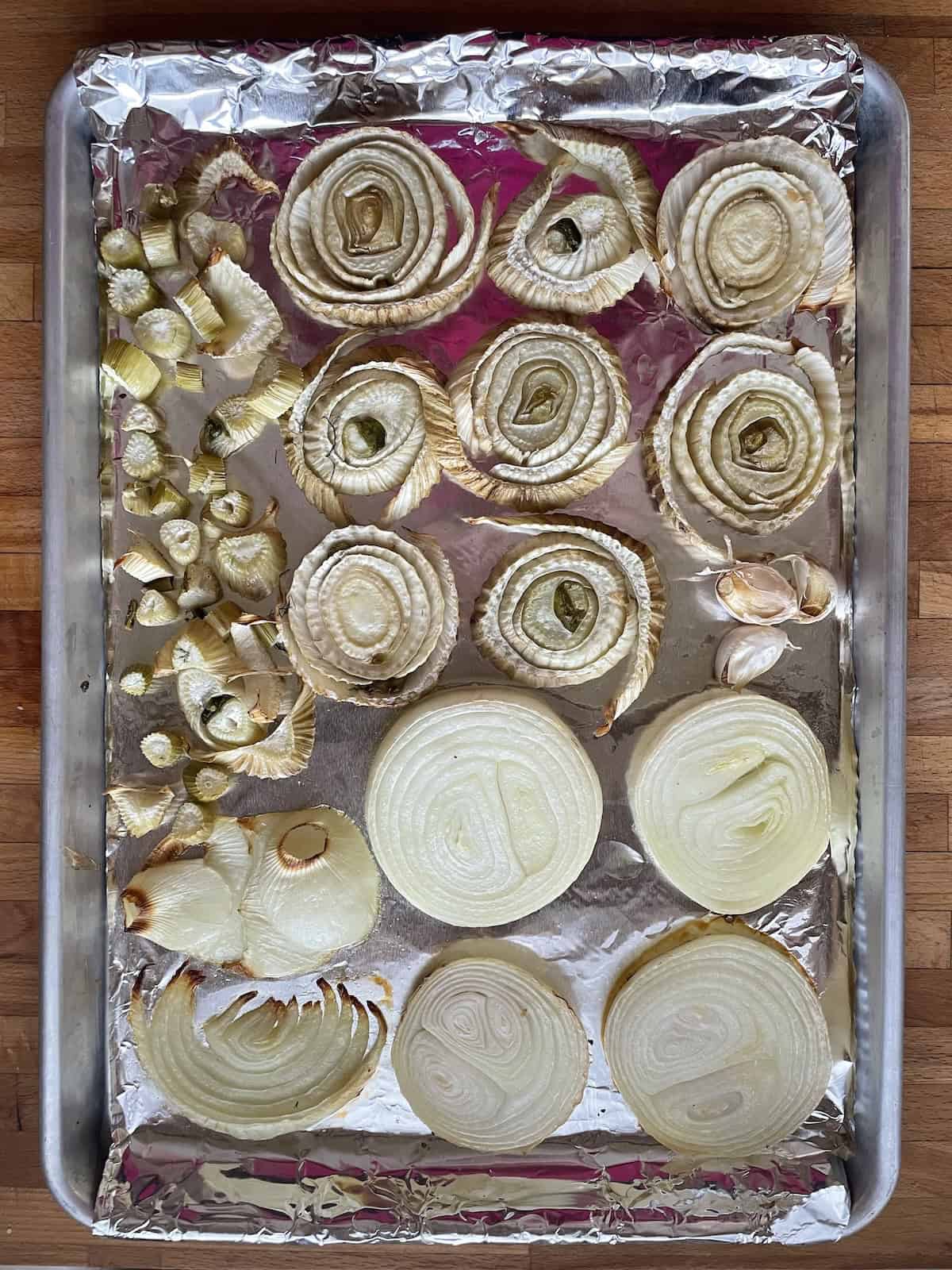 roasted fennel and onions on baking sheet