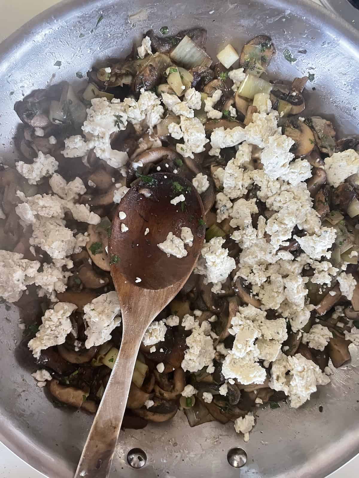 add herbed cheese and cream to skillet