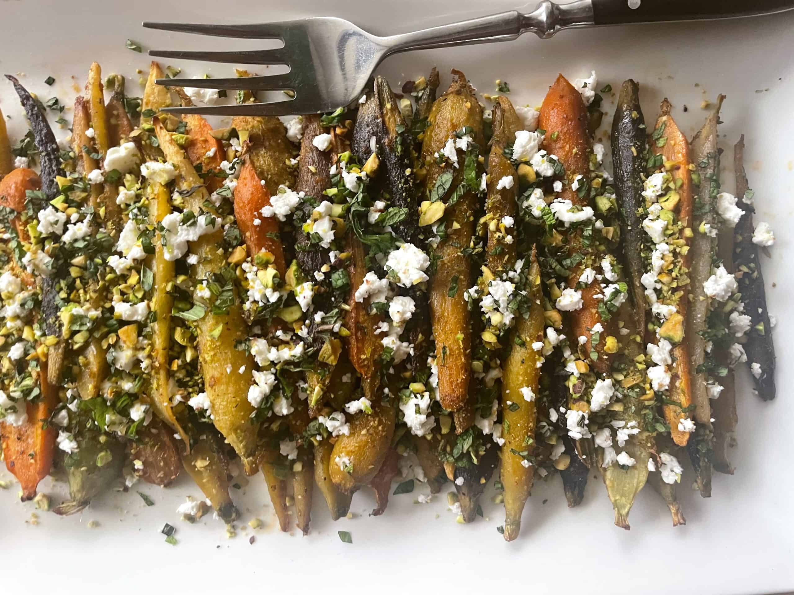 Harissa and Honey Carrots with Feta and Pistachios on a serving platter