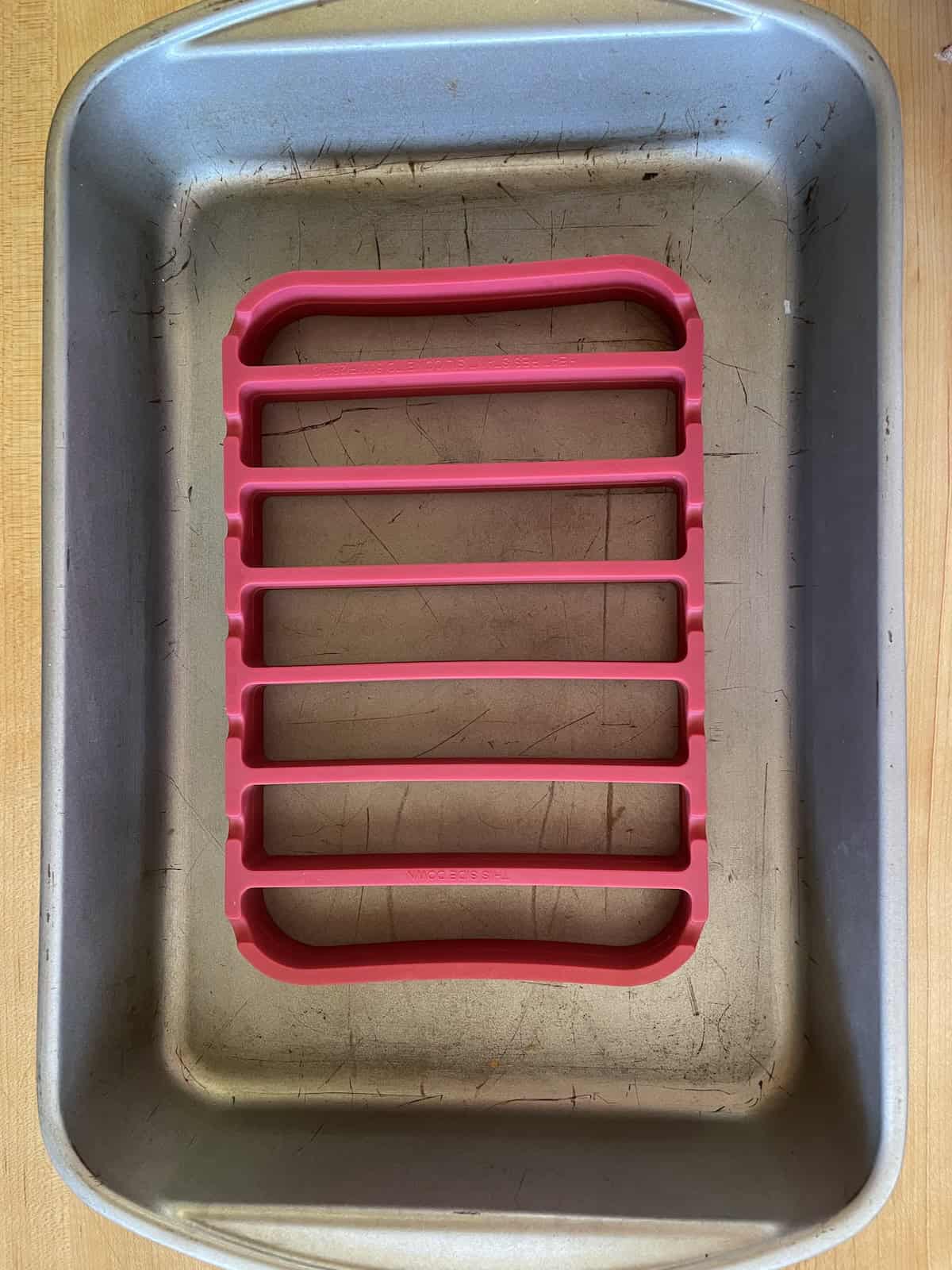 placing roasting rack in pan