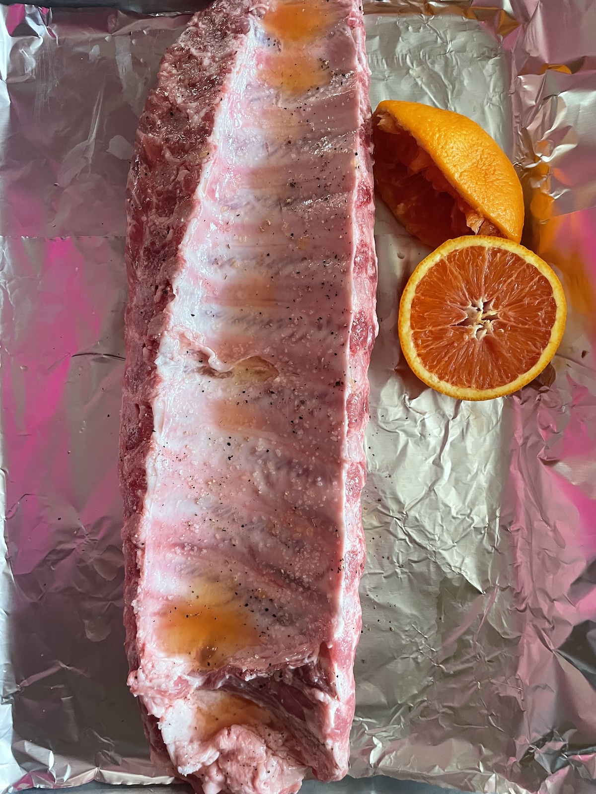ribs on foil with orange juice