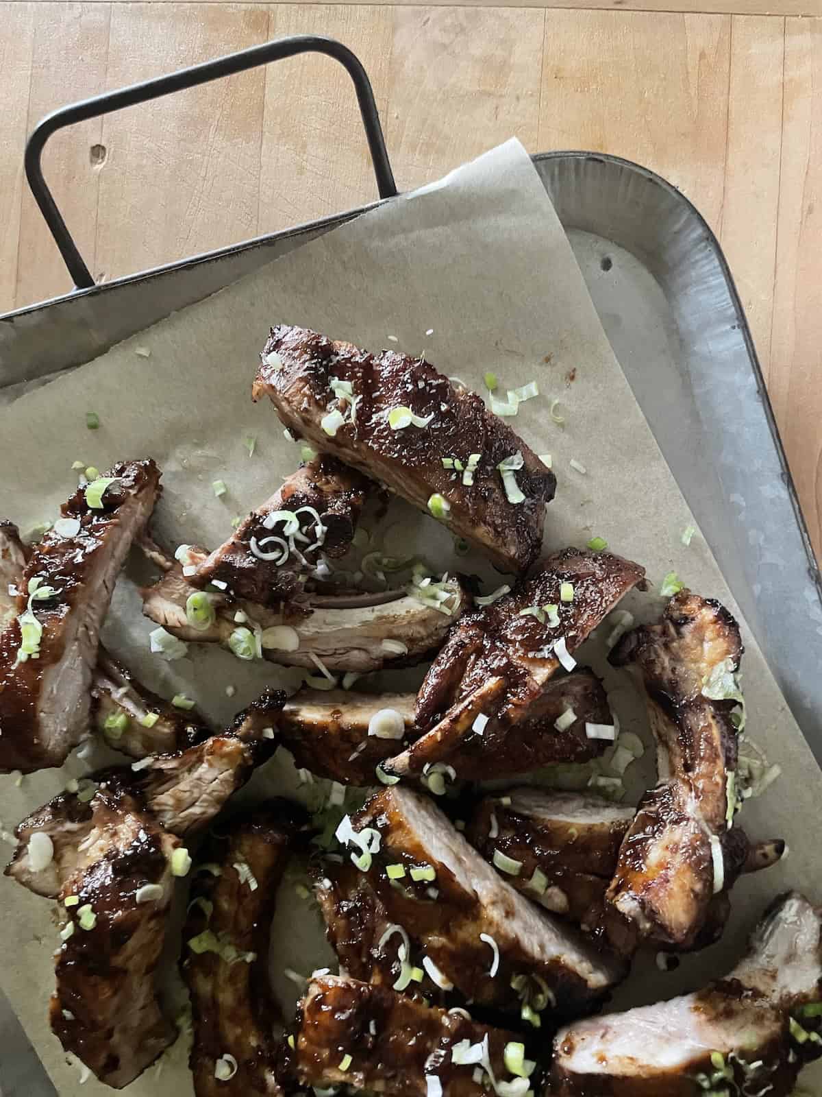 ribs finished with a sprinkling of scallions