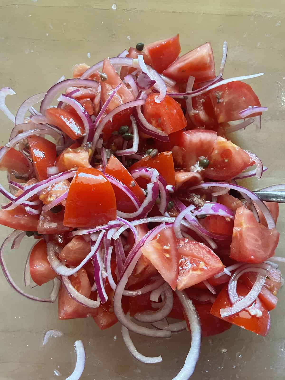 toss with tomatoes and onions