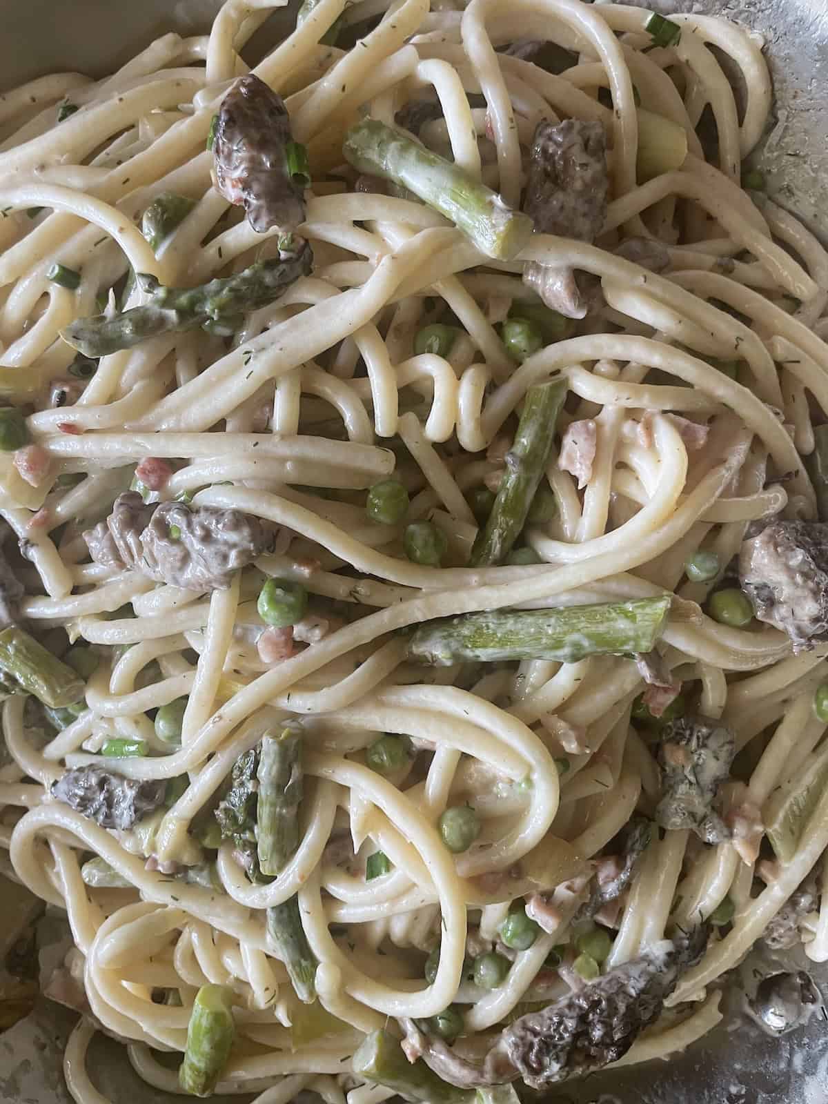 toss sauce with pasta and chives