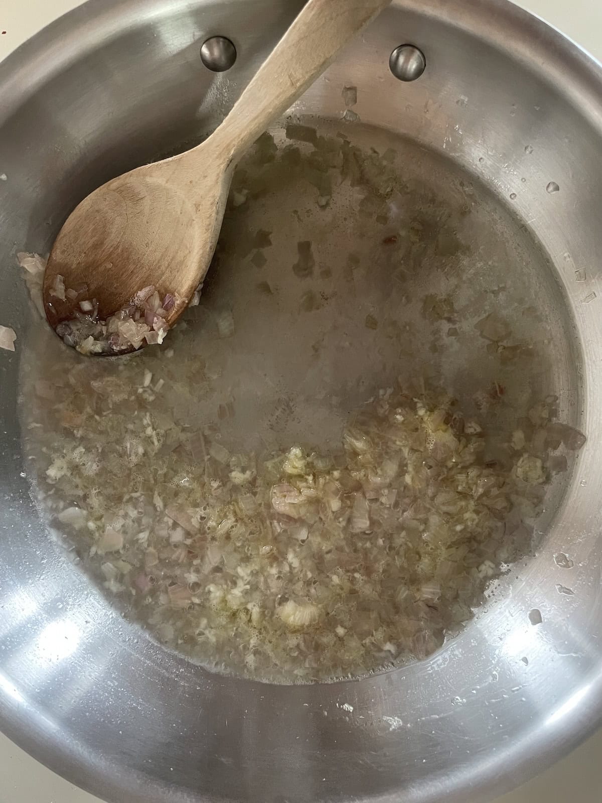 Add wine and reduce