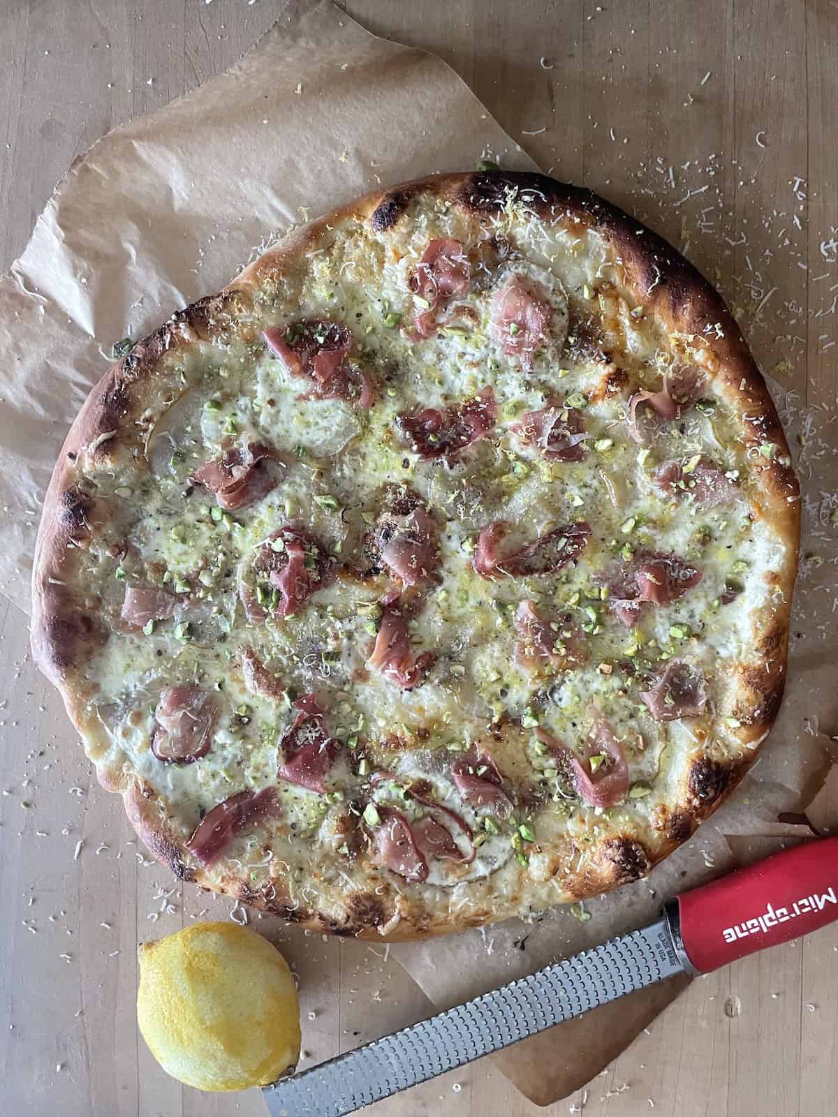 top with pistachios, lemon, Grana pad and honey.