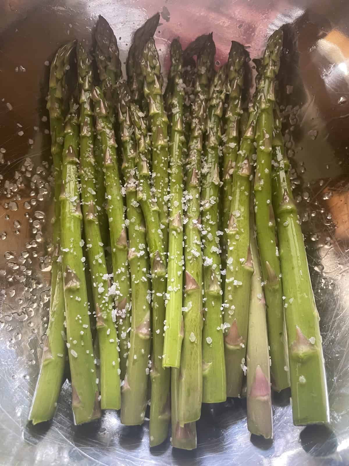 toss asparagus with salt, pepper and olive oil