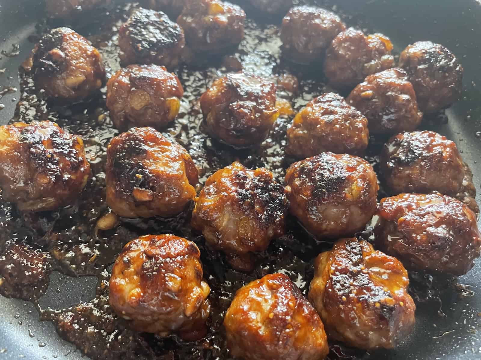 Moroccan Lamb, Raisin and Pinenut Meatballs with Fig and Balsamic Glaze in skillet
