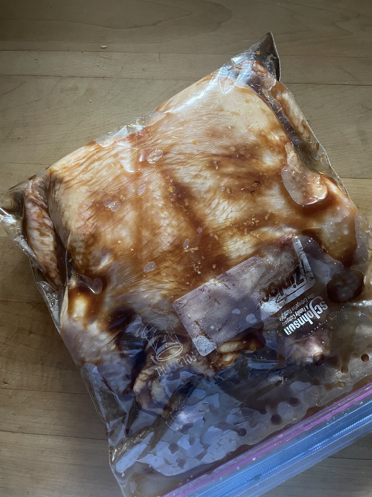 chicken marinating in bag