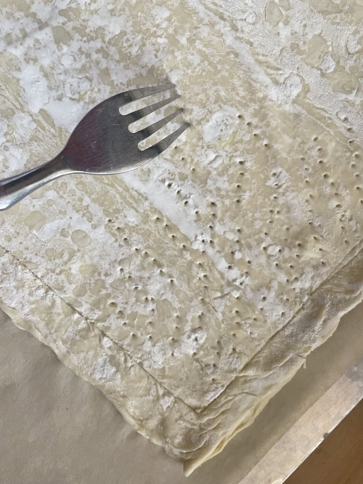 puff pastry scored and pricked with a fork