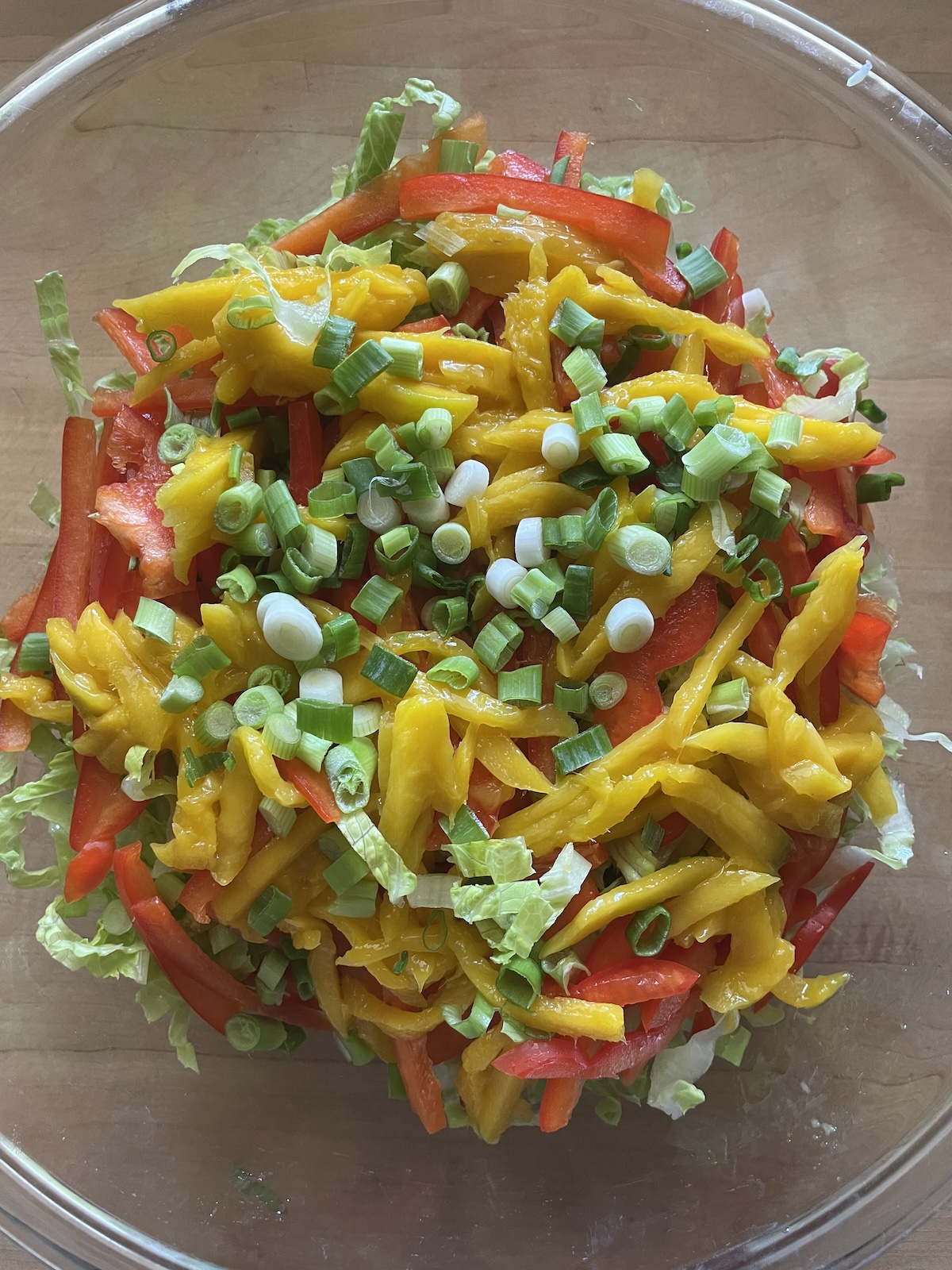 adding red bell pepper, mango and scallions